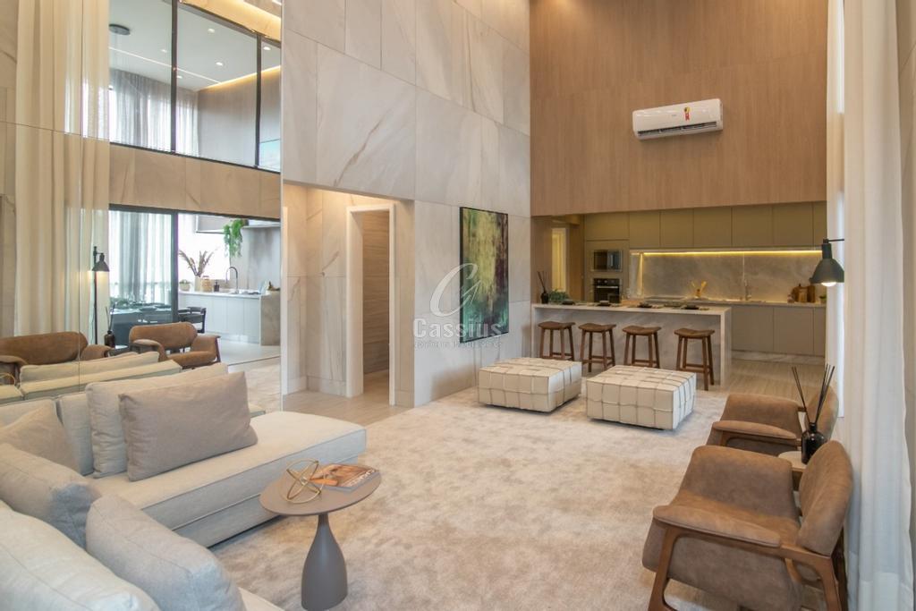 Vista ampla do living do apartamento decorado com pé-direito duplo e mezanino